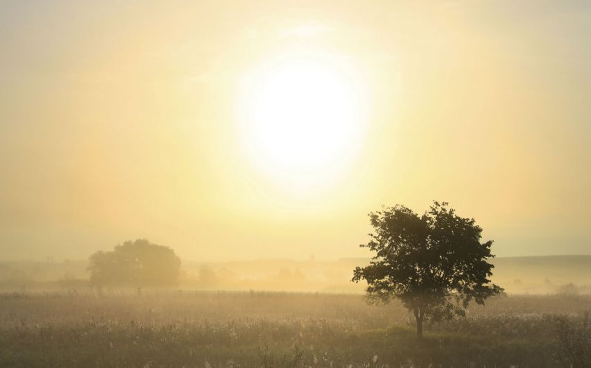 Zeitumstellung Winterzeit: Landschaft mit Sonnenaufgang